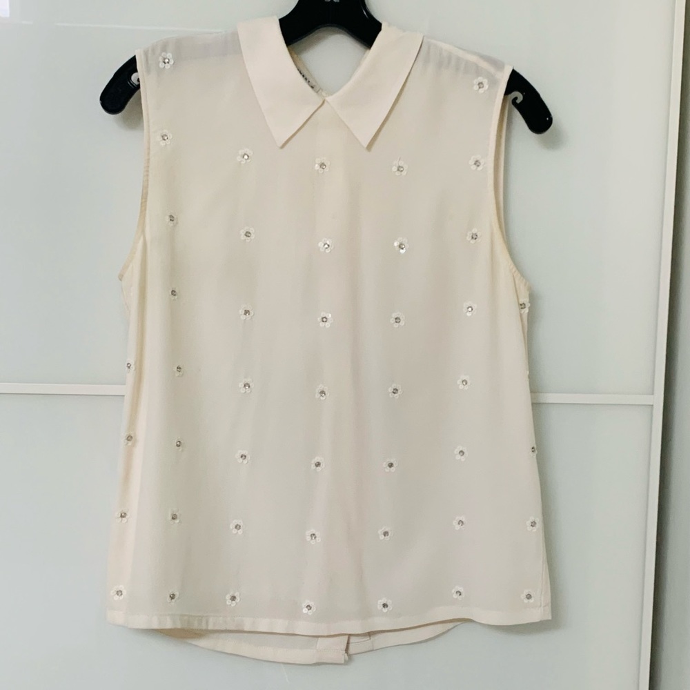 Selling Equipment sleeveless white top in size XS